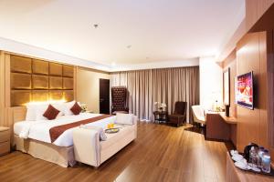 Krevet ili kreveti u jedinici u okviru objekta Tara Hotel Yogyakarta