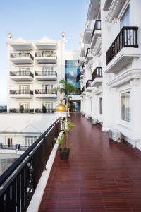 an empty balcony of a building with plants at Tara Hotel Yogyakarta in Yogyakarta