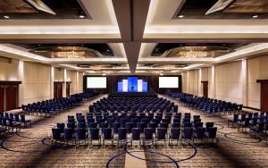 a large room with chairs and a stage in it at Hyatt Regency Vancouver in Vancouver