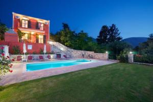 a house with a swimming pool in a yard at superb villa with private pool peaceful location in Sami