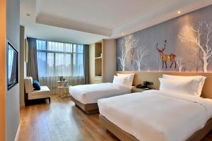 Postel nebo postele na pokoji v ubytování Byland Star Hotel