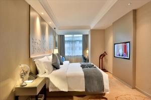 Ένα ή περισσότερα κρεβάτια σε δωμάτιο στο Byland Star Hotel