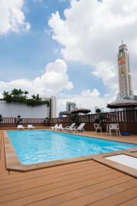 a swimming pool on the roof of a building at True Siam Rangnam Hotel in Bangkok