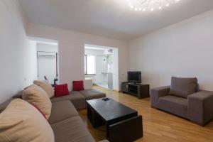 a living room with a couch and a table at Umba Apartment N2 in Yerevan