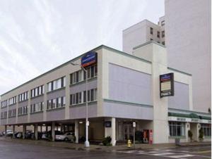 a large building on a street with a parking lot at Howard Johnson by Wyndham Atlantic City in Atlantic City