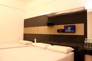 TV a/nebo společenská místnost v ubytování Time Hotel