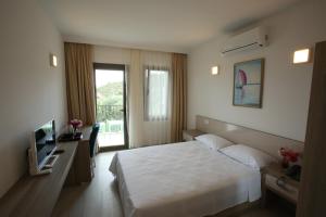 Postel nebo postele na pokoji v ubytování Aria Doria Otel + 37 fotografií
