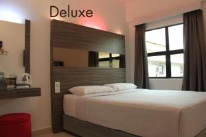 Postel nebo postele na pokoji v ubytování Time Hotel