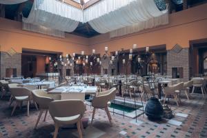 a restaurant with tables and chairs in a room at Iberostar Selection Marbella Coral Beach in Marbella