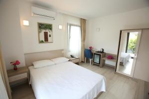Postel nebo postele na pokoji v ubytování Aria Doria Otel