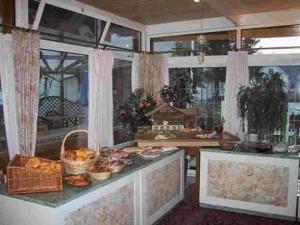 a kitchen with a counter with some food on it at Hotel Gasthof Stern in Mindelheim