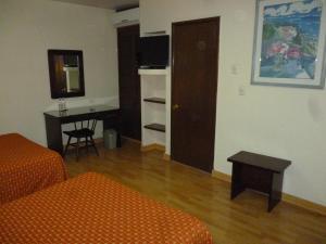 Ένα ή περισσότερα κρεβάτια σε δωμάτιο στο Hotel La Casona del Llano