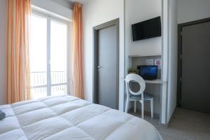 TV a/nebo společenská místnost v ubytování Hotel Olympia