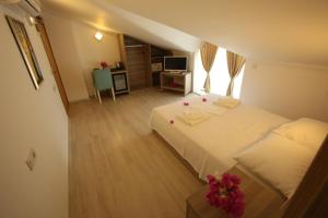 Postel nebo postele na pokoji v ubytování Aria Doria Otel