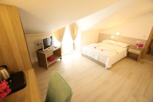 Postel nebo postele na pokoji v ubytování Aria Doria Otel