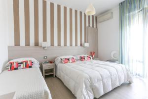Postel nebo postele na pokoji v ubytování Hotel Olympia