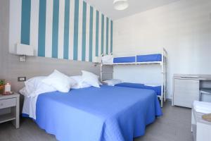 Postel nebo postele na pokoji v ubytování Hotel Olympia