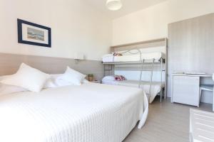 Postel nebo postele na pokoji v ubytování Hotel Olympia