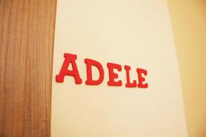 aadobeadobe sign on a wall with the word adelaide at BB Aretè in Scilla