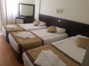 Postel nebo postele na pokoji v ubytování Zel Hotel