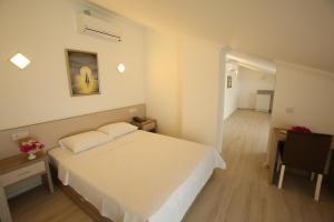 Postel nebo postele na pokoji v ubytování Aria Doria Otel