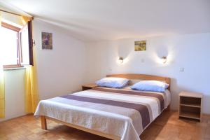 Posteľ alebo postele v izbe v ubytovaní Apartman Branka- Sea view