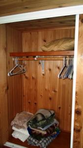 a closet with a wooden paneled wall at Cedar Pines Resort in South Lake Tahoe