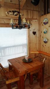 a wooden table and chairs in a room with a window at Cedar Pines Resort in South Lake Tahoe