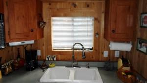 a kitchen with a sink and a window at Cedar Pines Resort in South Lake Tahoe