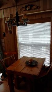 a dining room table with a plate on top of it at Cedar Pines Resort in South Lake Tahoe