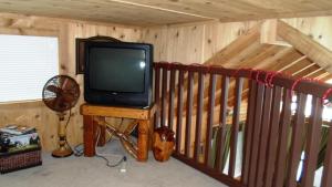 a television sitting on a table in a room at Cedar Pines Resort in South Lake Tahoe