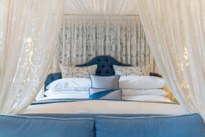 A bed or beds in a room at Stapleford Park Luxury Hotel 