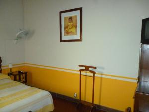 Säng eller sängar i ett rum på Hotel Monte Alban - Solo Adultos
