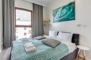 Posteľ alebo postele v izbe v ubytovaní GRANO APARTMENTS Gdańsk Motława SPA & Wellness