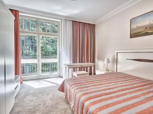 Postel nebo postele na pokoji v ubytování Apartment Villa Dionysus + 28 fotografií