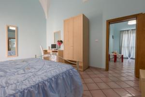 Un pat sau paturi într-o cameră la Le Dimore dei Messapi
