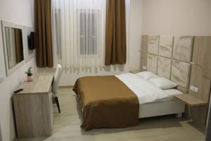 A bed or beds in a room at Ideal city