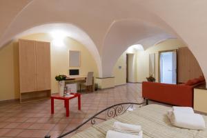 a living room with a couch and a table at Le Dimore dei Messapi in Ugento