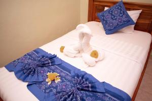 Postel nebo postele na pokoji v ubytování Suparsa's Homestay
