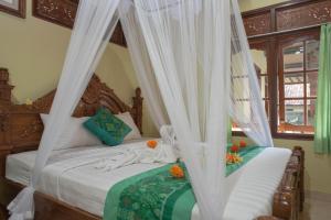 Postel nebo postele na pokoji v ubytování Suparsa's Homestay