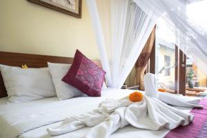 Postel nebo postele na pokoji v ubytování Suparsa's Homestay