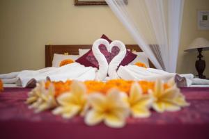 Postel nebo postele na pokoji v ubytování Suparsa's Homestay