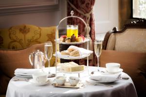 a table with a tray of food on top of it at Stapleford Park Hotel & Spa in Melton Mowbray