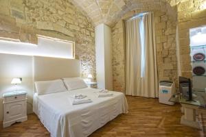 Voodi või voodid majutusasutuse Chiesa Greca Suites - Lecce Selection toas