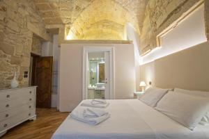 Voodi või voodid majutusasutuse Chiesa Greca Suites - Lecce Selection toas