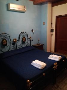 Posteľ alebo postele v izbe v ubytovaní B&B funtanadetalia