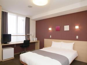 Postel nebo postele na pokoji v ubytování Quad Inn Yokote + 20 fotografií