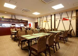 A restaurant or other place to eat at Quad Inn Yokote
