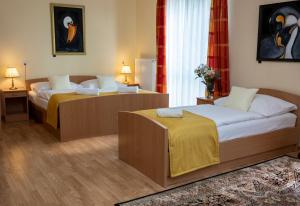 Postel nebo postele na pokoji v ubytování Pavilon