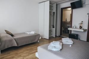 מיטה או מיטות בחדר ב-Residenza al Castello